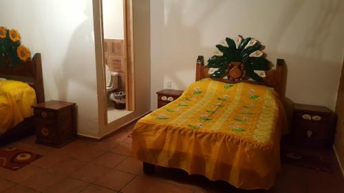 A bed or beds in a room at Hotel Jardin Rincon de las Estrellas
