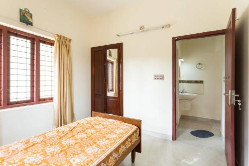מיטה או מיטות בחדר ב-Stay at DBRA 61 Don Bosco Cross Road Vaduthala Ernakulam