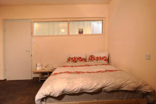 Una cama o camas en una habitación de Spice Quarter Inn