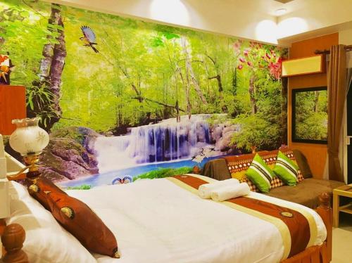 Tempat tidur dalam kamar di Rayong Condochain by Rainbow