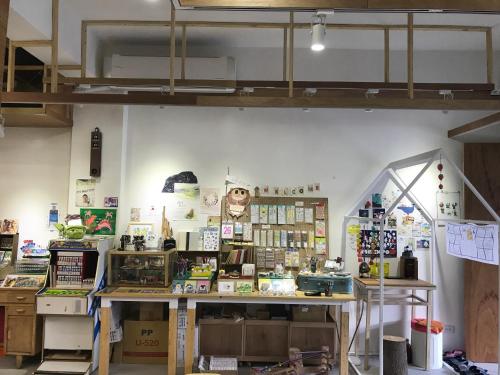 a shop with a lot of items on the wall at Welcome Hostel in Hualien City