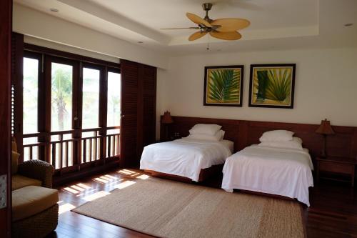 Giường trong phòng chung tại 4BR Pearl Villa at Furramar Danang