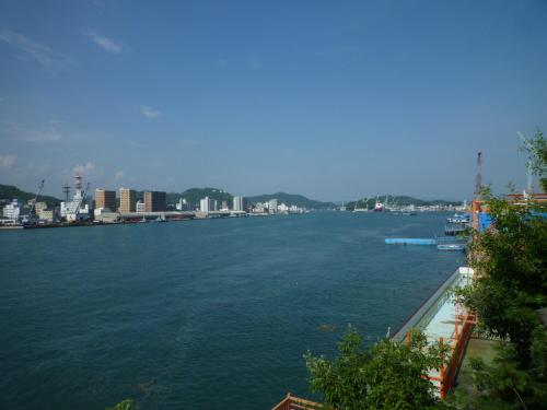 a large body of water with a city in the background at Sea Side Hostel Light House in Onomichi