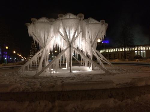 a structure covered in snow in front of a building at Hotel Schweizer Hof Thermal und Vital Resort in Bad Füssing