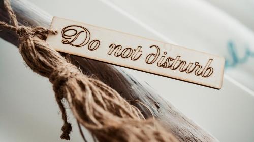 a sign that reads do not disturb hanging on a rope at Aelia Wellness Retreat in Nicosia