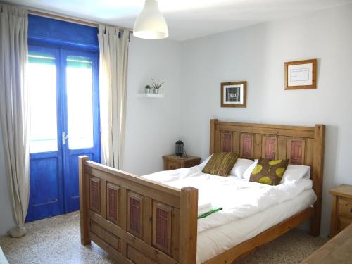 Un pat sau paturi într-o cameră la Il Monte Farmhouse
