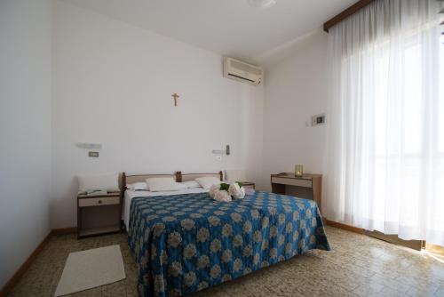 Postel nebo postele na pokoji v ubytování Hotel Lem-Casadei
