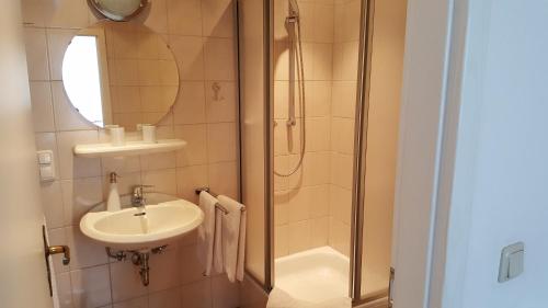 a bathroom with a sink and a shower at Haus Christiane in Cochem