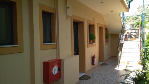 a hallway of a building with a fire hydrant on the side at Nikolitsa Apartments in Glyfada Fokidas