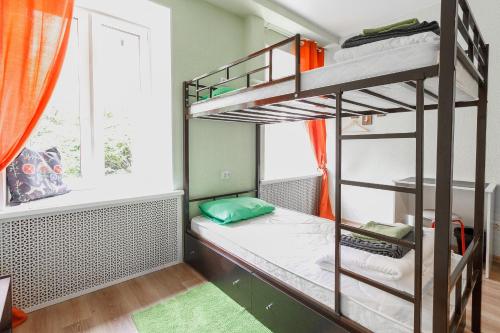 a room with two bunk beds and a window at Nice на Моховой in Saint Petersburg