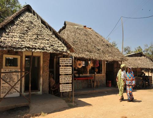 two women standing in front of a hut at Shimoni Reef Lodge in Shimoni