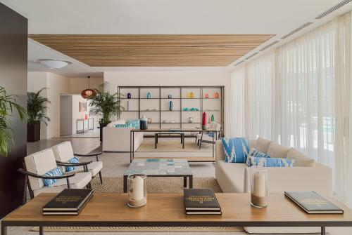 a living room with a couch and a table at H10 Casa del Mar in Santa Ponsa