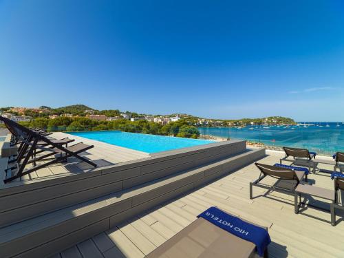 a swimming pool on the roof of a building at H10 Casa del Mar in Santa Ponsa