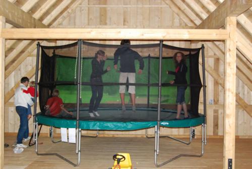 a group of people standing on a trampoline in a room at Ferienhof Karin und Florian Gressenbauer in Edlbach