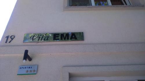 a sign that says tilla emma on the side of a building at Vila Ema Apartments and Rooms in Ljubljana