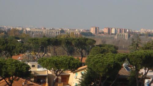 a view of a city with trees and buildings at Hotel Capannelle Roma in Rome