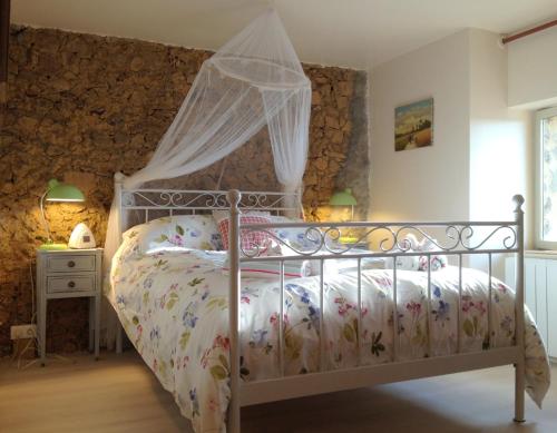 En eller flere senge i et værelse på Gites Limousin - La Vienne