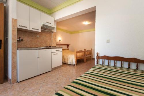 Η κουζίνα ή μικρή κουζίνα στο Apartmani Antonella