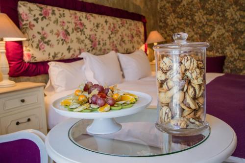 a plate of food on a table in a hotel room at Hotel Dragului in Predeal