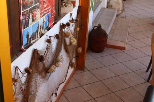 a wall with some decorations on it at Guesthouse Santor in Lastovo