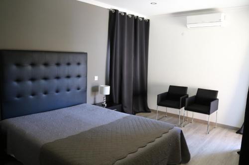 Кровать или кровати в номере Casa do Regedor