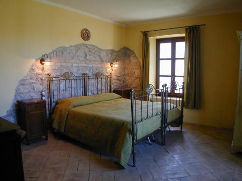 Cama ou camas em um quarto em Agriturismo Terre di Musignano