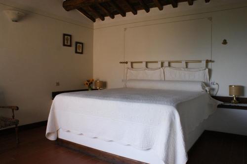 Una cama o camas en una habitación de Casa Lucia in Chianti