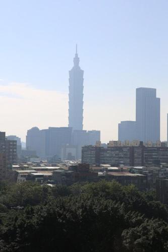 a city skyline with a tall building in the distance at Hotel Lee-Chan in Taipei