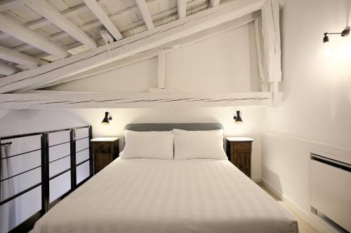Tempat tidur dalam kamar di Al Foro Annonario