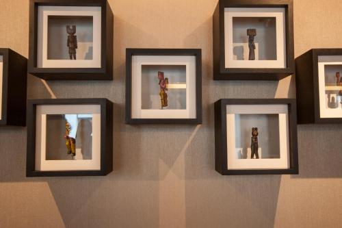 a group of framed photos on a wall at Hyatt Centric Guatemala City in Guatemala