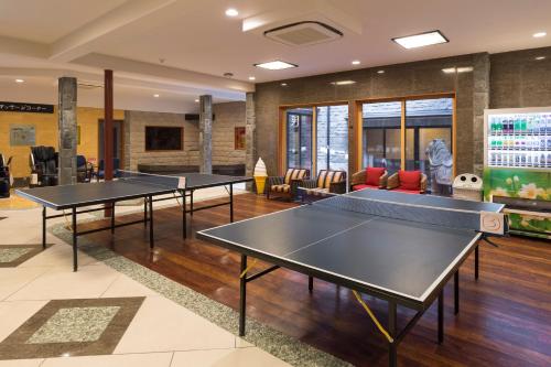 two ping pong tables in a ping pong room at Awara Grand Hotel in Awara