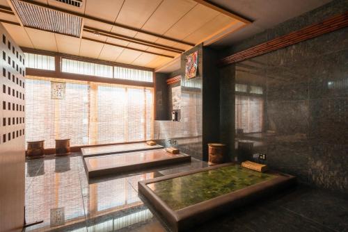a large room with a pool in the middle at Awara Grand Hotel in Awara