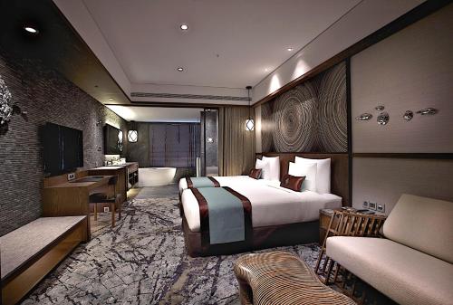 a large hotel room with a bed and a bathroom at arTree hotel in Taipei
