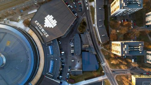 an aerial view of a city with a building at Hotel Diament Spodek in Katowice