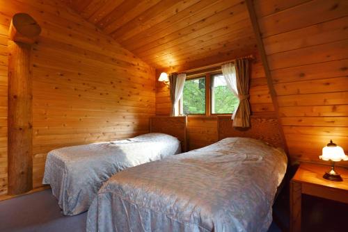 Katil atau katil-katil dalam bilik di Rental Log Urube Village