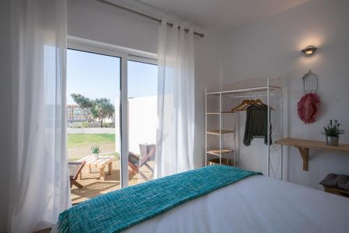 Postel nebo postele na pokoji v ubytování Eco Soul Ericeira Guesthouse - Adults Only