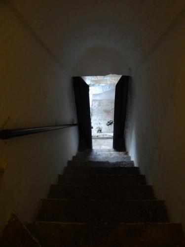 a stairway leading up to a building with two windows at Labboo'z Café and Lodge in Maheshwar