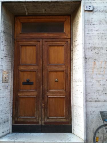a wooden door on the side of a building at Da Selly in Mantova