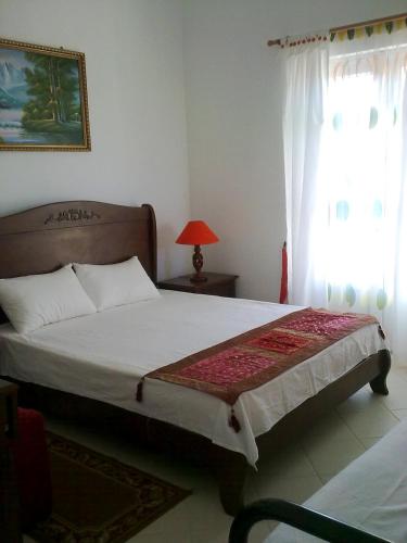 Postel nebo postele na pokoji v ubytování Golden Rod villa