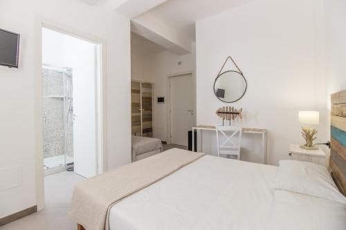 מיטה או מיטות בחדר ב-La casa di Gio'