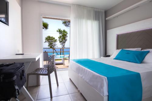 Postel nebo postele na pokoji v ubytování BV Kalafiorita Resort