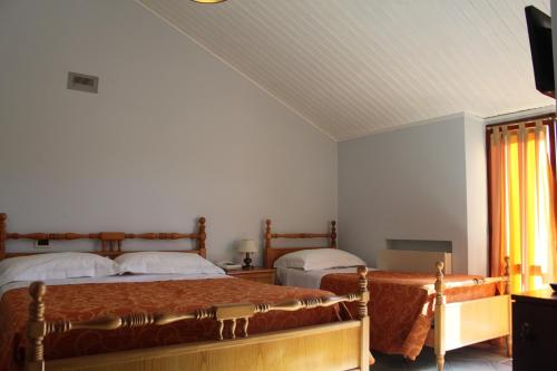 Tempat tidur dalam kamar di Hotel Girasole