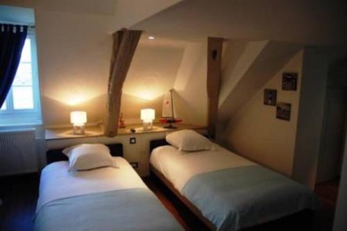 Giường trong phòng chung tại chambres d'hotes saint hubert