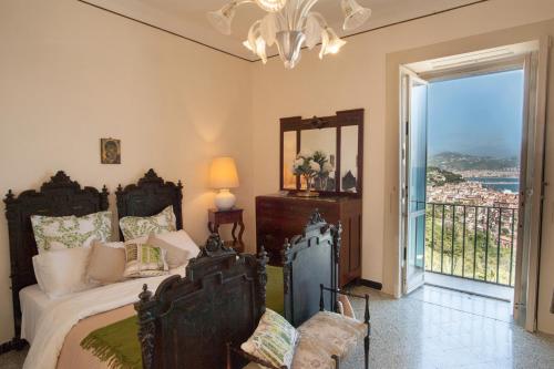 a bedroom with a bed and a view of the ocean at Residence Mareluna - Amalfi Coast by Mareluna Hotel in Vietri sul Mare