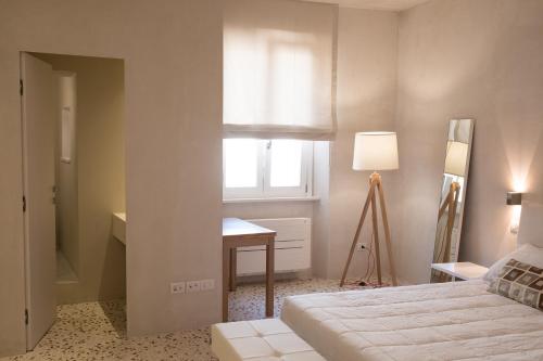 Postel nebo postele na pokoji v ubytování Residenza Corso Baccio