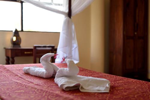 Ένα ή περισσότερα κρεβάτια σε δωμάτιο στο Villa Serenity, Tanzania Unforgettable