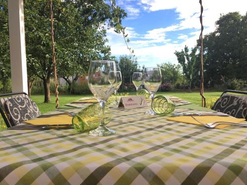 a table with three wine glasses on top of it at Vera Bed and Breakfast in Umag