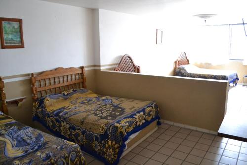 Postel nebo postele na pokoji v ubytování Hotel Plaza Romo