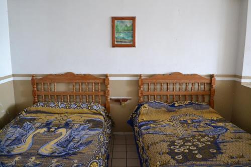 Postel nebo postele na pokoji v ubytování Hotel Plaza Romo