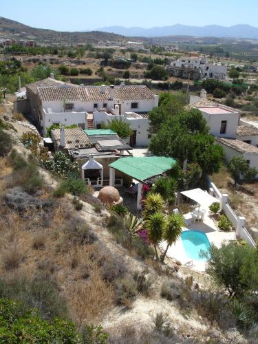 an aerial view of a house with a swimming pool at Almond Reef Casa Rural in Los Alias